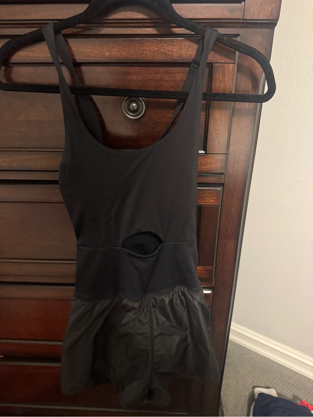 Women’s one piece black athletic romper with cut out